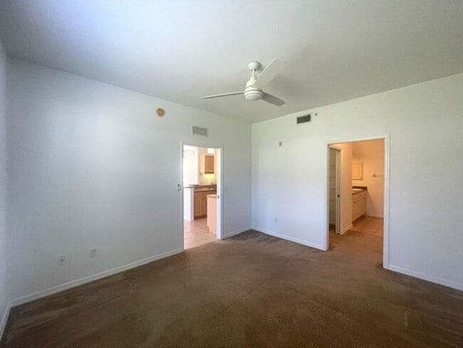 Building Photo - Elegant 3 Bedroom End-Unit Condo with Screened Lanai & Pond Views and A Private Garage