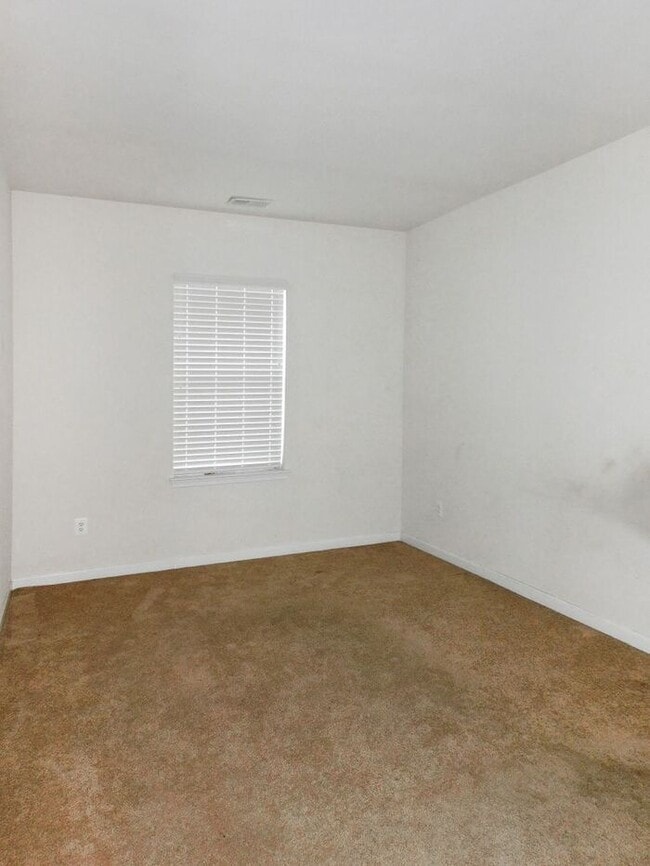 Building Photo - Pet Friendly Condo with Deck and 1 Car Garage
