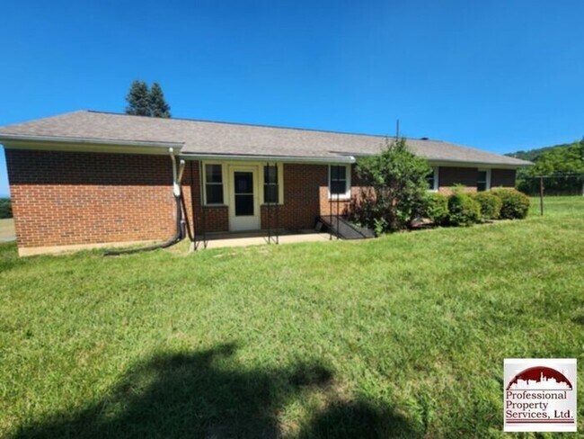 Building Photo - Charming Brick Rancher Offers A Perfect Blend Of Country Living And Convenience