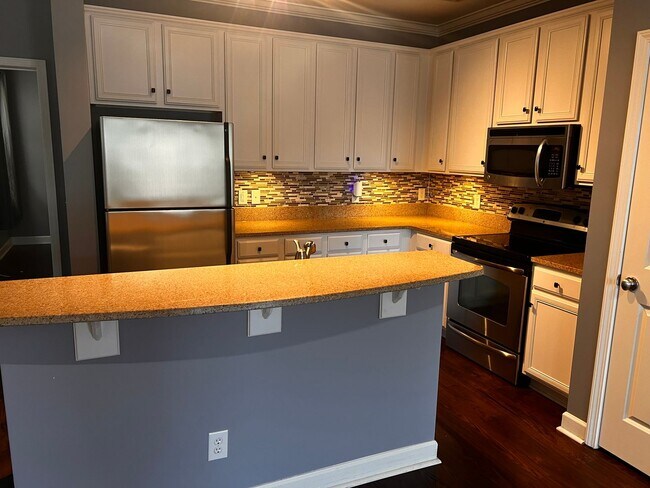 Building Photo - Now Available! Luxury three-bedroom townhome in St. James Square in Myrtle Beach.