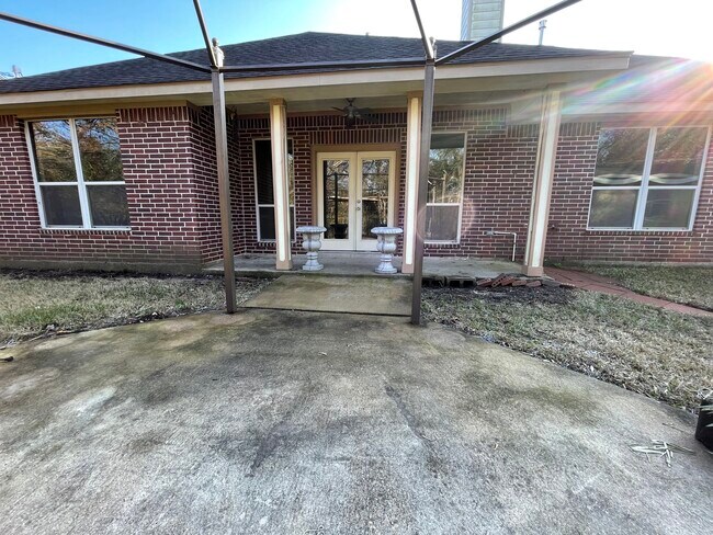Backyard covered patio view - 600 River Bend Dr