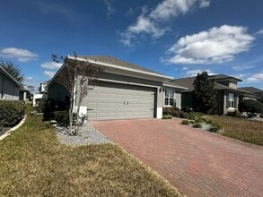 Building Photo - Welcome to this inviting 3/2 single family home located in Compass Landing