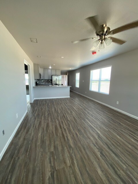 Open floorplan living/dining area with seating at kitchen bar also - 3876 County Road 123