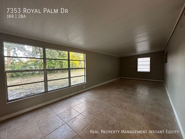 Building Photo - 7353 Royal Palm Dr