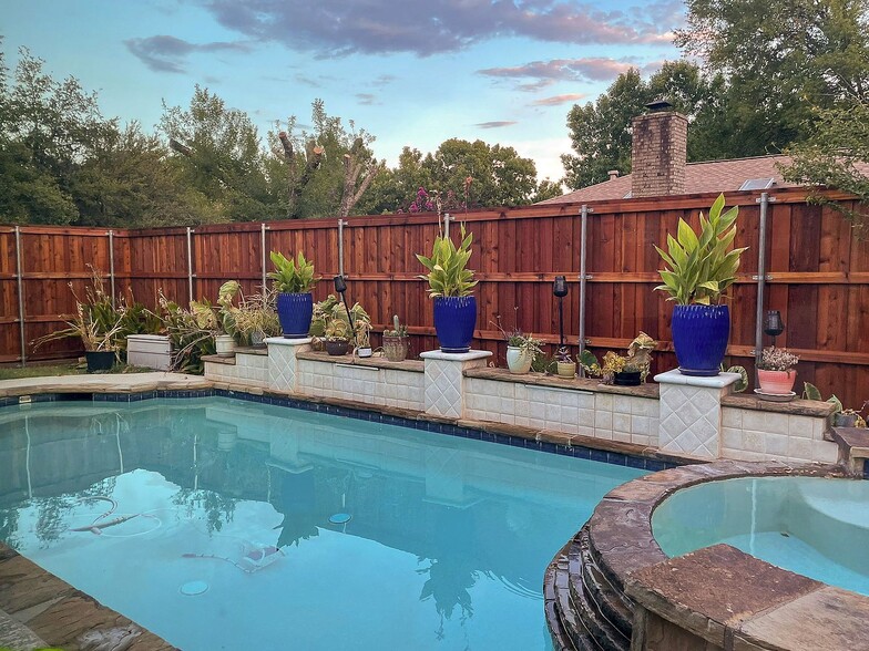 Pool area with decorative blue planters and cedar cedar fence - 2006 Candle Ct