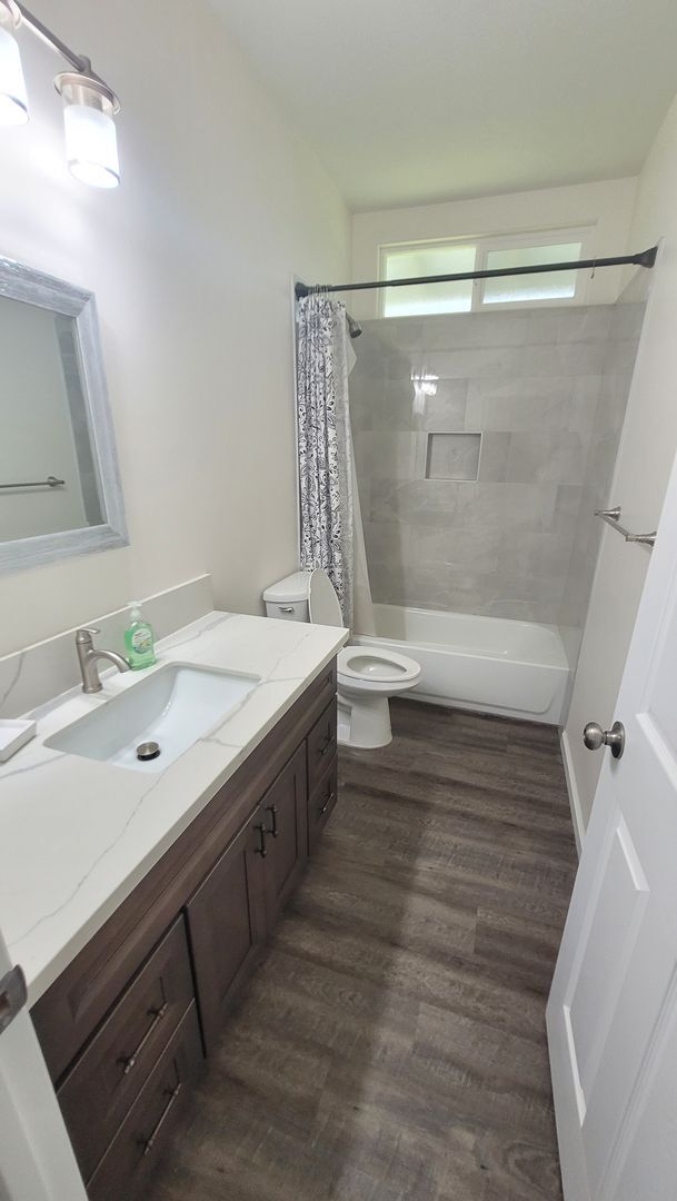 Building Photo - This 3-bedroom, 2-bath home in Orchidland Subdivision