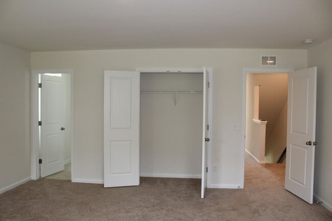 Building Photo - Sun-Filled 3-Story End-Unit Townhome with Fenced Yard, Storage & Resort-Style Pool