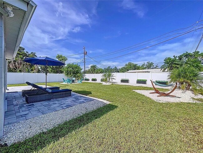 Building Photo - Modern luxury meets Florida charm in this ...