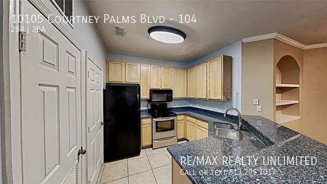 Building Photo - 10105 Courtney Palms Blvd