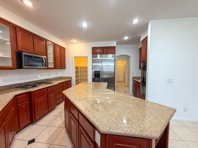 Building Photo - SPACIOUS HOME IN GATED COMMUNITY WITH POOL, RV PARKING & 4-CAR GARAGE!