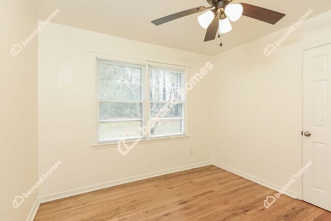Building Photo - This Cozy 4 bedroom / 2 full bath and 2,09...