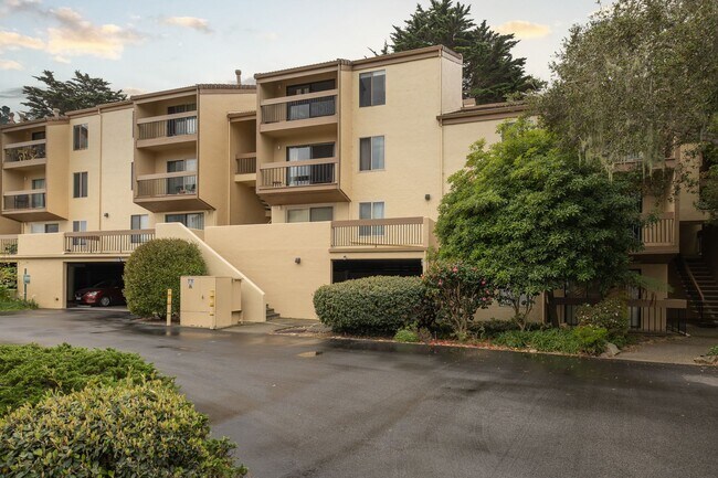 Building Photo - Peaceful Forest-View Condo with Fireplace & Private Balcony in Golden Oaks