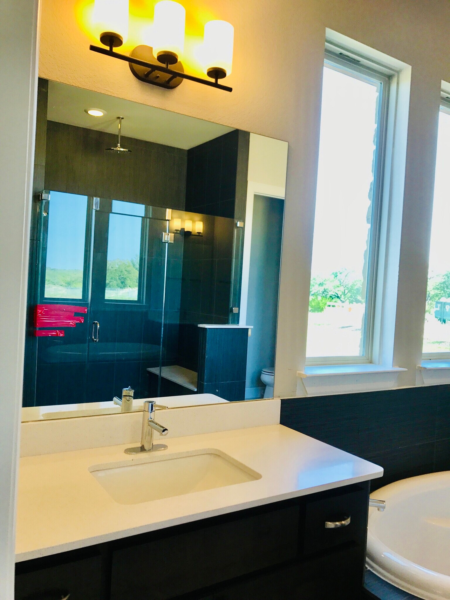 Walk-in shower with custom bench and dual rain shower heads - 429 Pink Granite Blvd