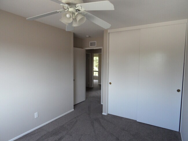 Building Photo - Two Story 4 BR 2.5 BA Condo With 2 Car Garage