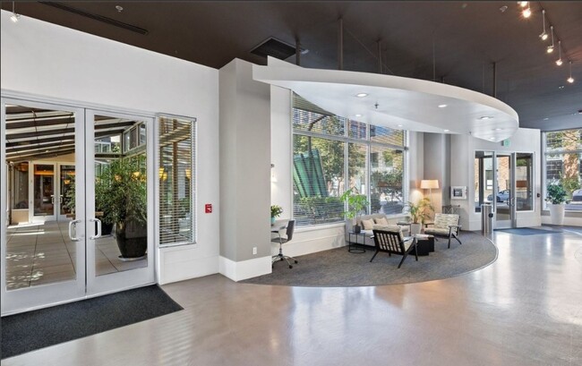 Building Photo - Chic 1-Bedroom Condo with Stunning City & ...