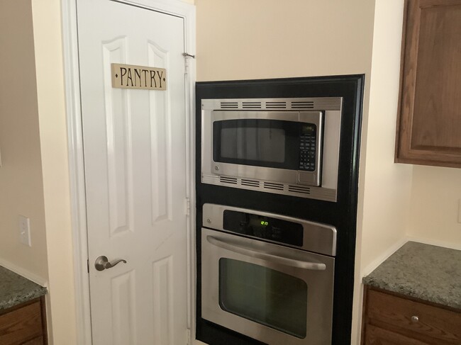 Stainless steel appliances built in to wall - 11502 Grimes Ave