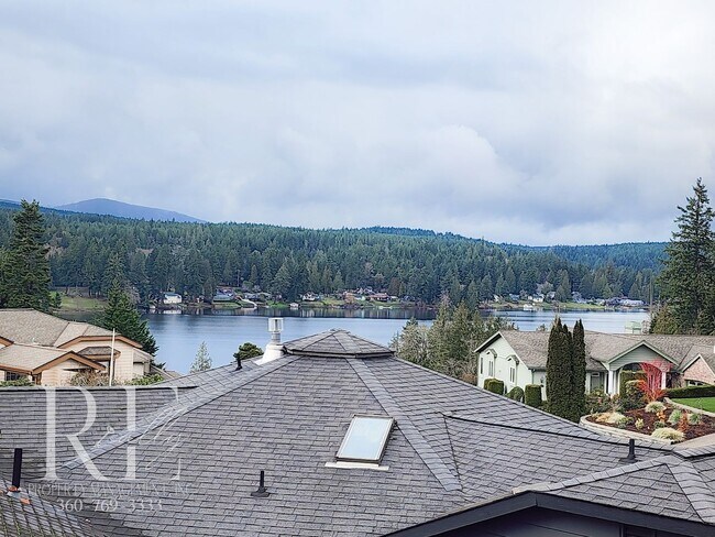 Building Photo - Modern Elegance Meets Tranquil Lakeside Living On Osprey Circle
