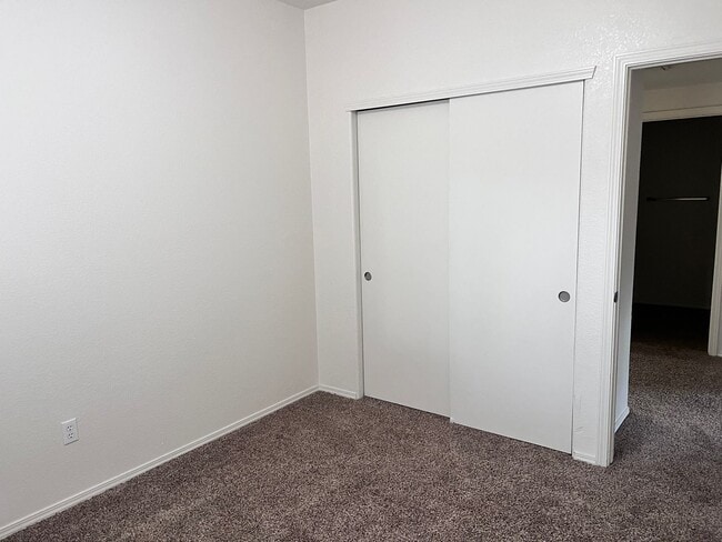 Building Photo - Wonderful 3 Br condo in gated community with the major appliances and 1 car garage.