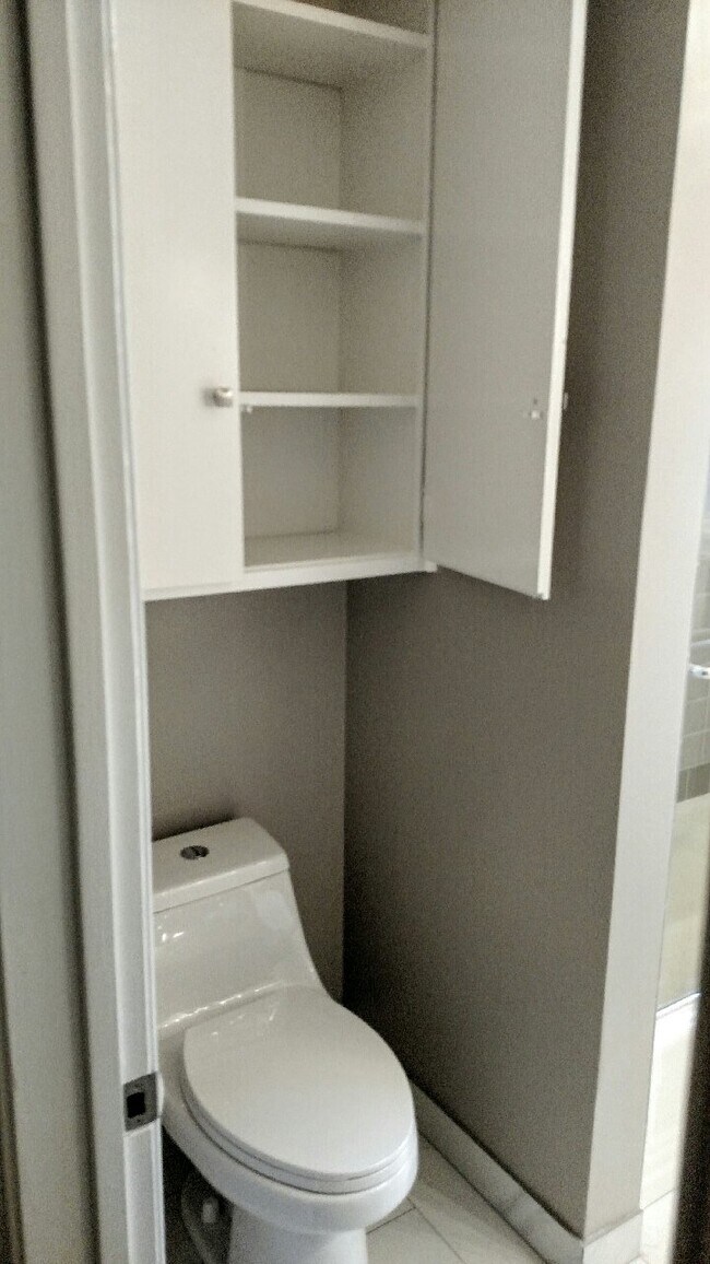 Toilet Main Bath with Storage - 5835 Tellefson Rd