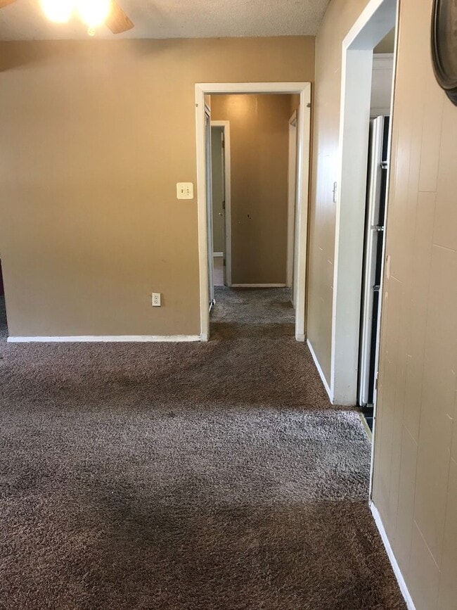 Building Photo - Nice, 4BR rancher with appliances, attached garage and fenced back yard.