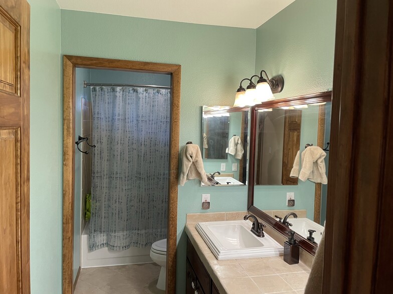 Guest bathroom with dual sinks - 3476 S Debbie St