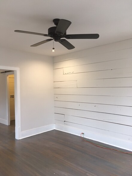 Living room with original shiplap accent wall - 1133 W Lynwood Ave