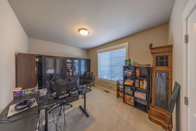 Building Photo - Four Bedroom Home + Bonus & Den in Gated C...