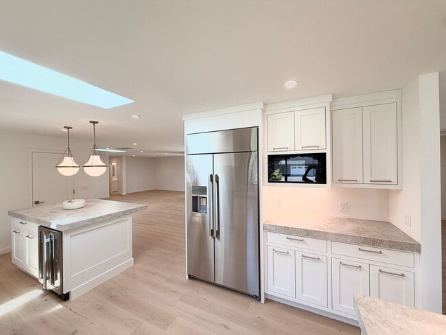 Building Photo - This premier 4-bed, 3-bath estate spans 2,565 sq. ft. on a 10,253 sq. ft. lot in North Los Altos.