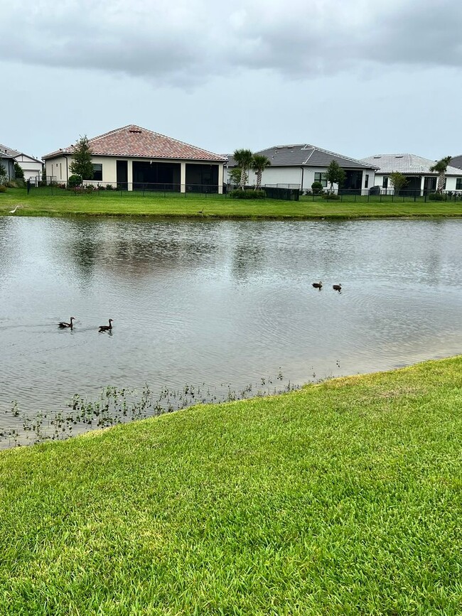 Building Photo - STUNNING LAKEFRONT 3 BEDROOM, 2.5 BATH HOM...