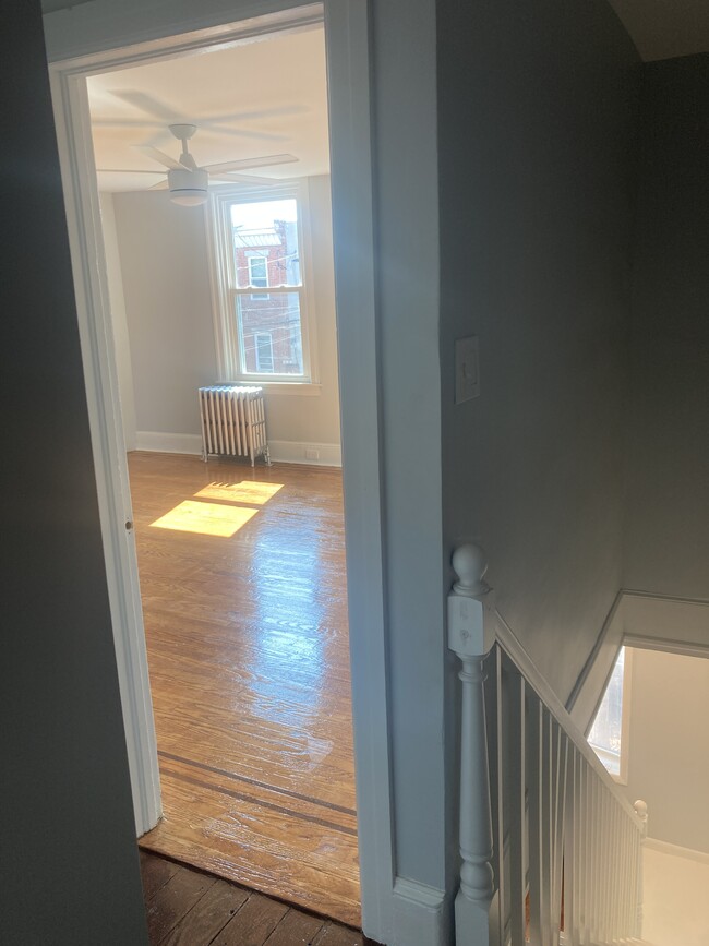 The front bedroom on the 2nd floor also enjoys excellent light and airflow thanks to three windows a - 2621 E Somerset St