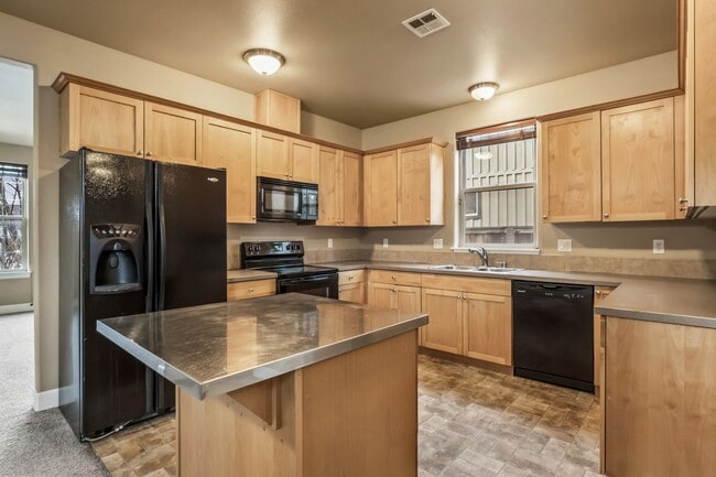 Building Photo - Spacious 4-Bedroom Home with New Paint & Carpet, Fenced Yard