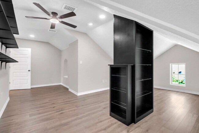 Building Photo - "Spacious 4-Bedroom Sanctuary with Cozy Fireplace in San Antonio's Prime Location!"