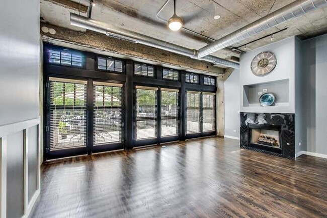 Floor to ceiling windows with fireplace - 1000 W 15th St