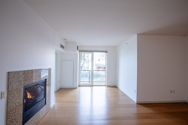 Building Photo - Sweet + secure 1/1 condo with parking, extra storage room + AC available now!