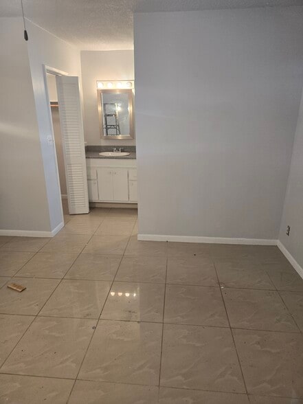 Bed and master bath - 490 SE 19th Ave