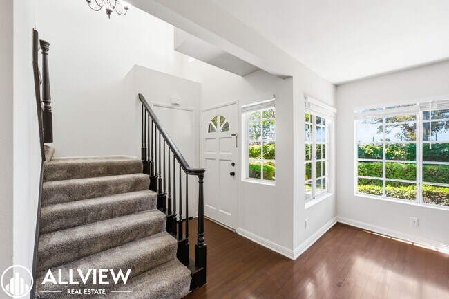 Building Photo - Fully Renovated 2 Bed Townhome with Private Patio, 2-Car Garage & Community Pool