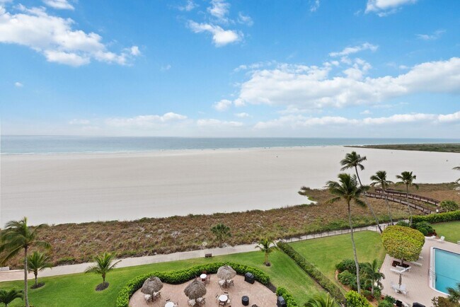 Building Photo - Get your Toes in the Sand at this Fully Furnished One Bedroom Beachfront Condo-Start June 1-2026