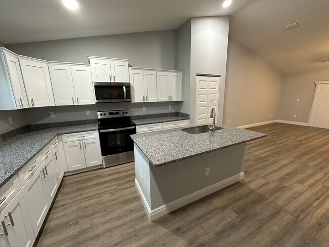 White Cabinetry with Granite Countertops - 9177 N Travis Dr