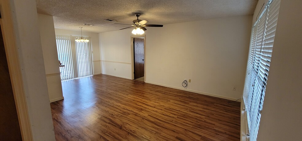 Walking in your front door to the living room area. - 1748 Port Dr
