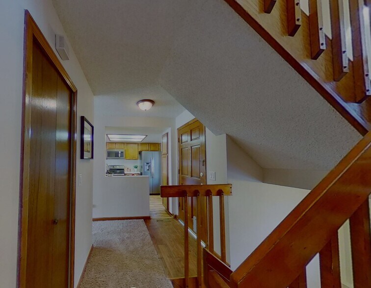 hallway from stairs to entrance and kitchen - 4226 S Granby St