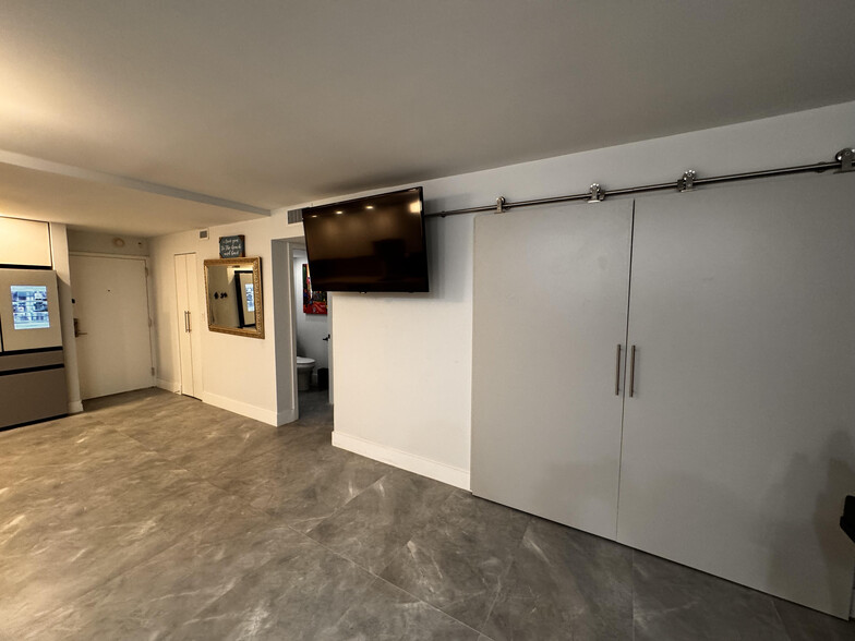 Aesthetic Barn Doors can close for privacy from the second bedroom/office. - 600 NE 36th St