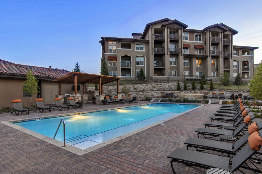 Swimming pool and sundeck with lounge seating - Avalon Denver West