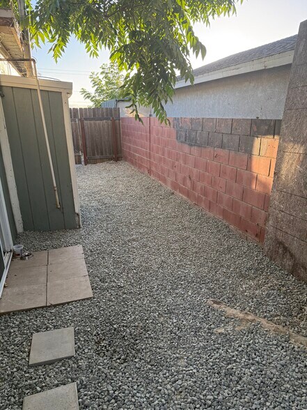 Private backyard entrance/exit. Sliding door to the right leads to patio room inside unit. - 18173 Brightman Ave