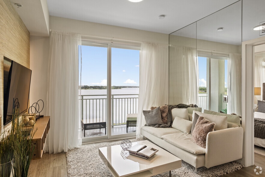 2BR, 2BA - 900SF - Living Room - Village at Mangonia Lake