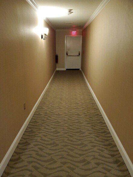 Your Corner unit is at end of 1st floor hall - 25116 Plantation Dr NE