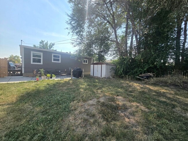Building Photo - Spacious 4 Bedroom Home with Fenced Yard +...