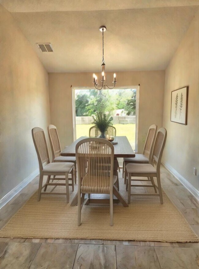 Building Photo - Welcome to this stunning 4-bedroom, 3-bath...