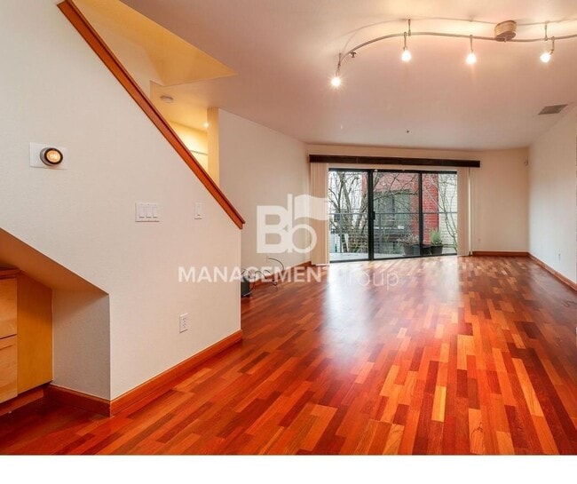 Building Photo - Spacious Riverfront Condo- Beautiful Condo w/River View from Bedroom! Parking Included!