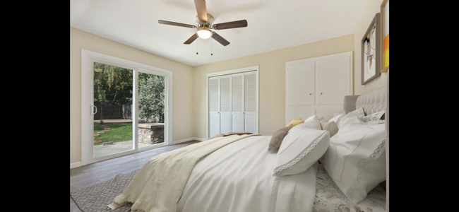 Masters bedroom and plenty of closet with the view of the yard - 6745 N Pershing Ave