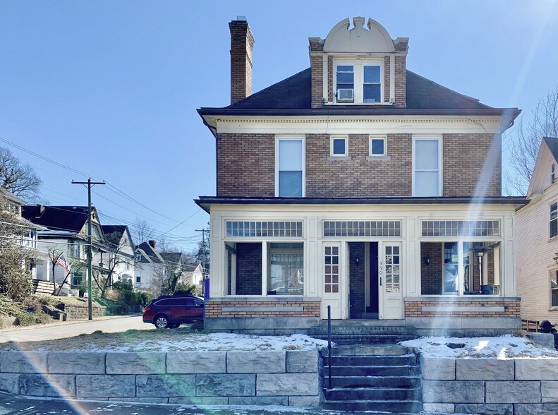 Street front of this 4-unit, yellow brick home in South Park, Morgantown - 350 Cobun Avenue